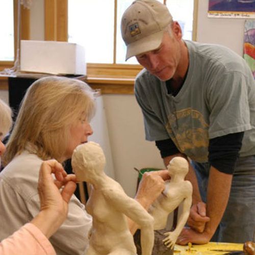 Students participating in a sculpting glass.